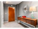 Entryway with console table, statement mirror, and modern lamp at 943 Peachtree Ne St # 1708, Atlanta, GA 30309