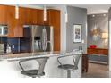 Modern kitchen features granite countertops, stainless steel appliances, and bar seating at 943 Peachtree Ne St # 1708, Atlanta, GA 30309