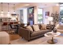 Inviting living area with comfortable seating, modern accents, and seamless access to an outdoor space and gourmet kitchen at 1820 Peachtree Nw St # 309, Atlanta, GA 30309