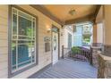 Inviting front porch with stone accents, decorative columns, and a stained wood deck at 3044 Dogwood Dr, Atlanta, GA 30354