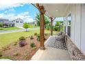 Relaxing front porch area featuring comfortable seating and a stylish black and white patterned rug at 165 Brookstone E Park, Acworth, GA 30101