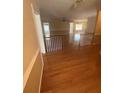 Spacious open-concept living room with hardwood floors, natural light, and seamless flow into the dining area at 1669 Azalea Dr, Lawrenceville, GA 30043