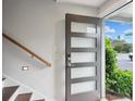Modern entryway featuring a front door with glass panels, wood stairs, and a sidelight to brighten the space at 1672 Dekalb Ne Ave # 2, Atlanta, GA 30307