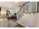 Open-concept living area with stone fireplace, vaulted ceilings, and modern railing staircase at 270 Shady Marsh Trl, Roswell, GA 30075