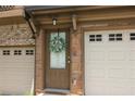 Inviting front entryway with stone accents and a decorative wreath at 3220 Creole Ln, Avondale Estates, GA 30002