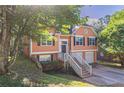 Charming two-story home with attached two-car garage and inviting front porch at 7074 Springgrove Ct, Austell, GA 30168