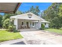 Charming home with a brick facade and a covered carport area at 105 Tranquility Dr, Villa Rica, GA 30180