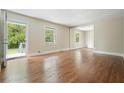 Open living room featuring hardwood floors and natural light, offering a versatile space for relaxation at 175 Smith Ferguson Rd, Dallas, GA 30157