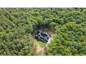 This luxurious home is a new construction build, surrounded by a dense grove of beautiful hardwood trees at 5567 Tyree Rd, Winston, GA 30187