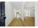 View of the entry foyer showcasing wood flooring and open floor plan at 6027 Windfall Ct, Powder Springs, GA 30127