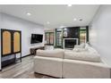 Bright living room featuring a fireplace, hardwood floors, and ample natural light at 2908 Woodruff Se Dr, Smyrna, GA 30080