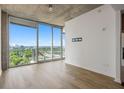 Spacious living room boasting floor to ceiling windows and beautiful city views at 361 17Th Nw St # 2607, Atlanta, GA 30363
