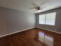 Bedroom featuring hardwood floors, neutral paint, and a ceiling fan for added comfort at 3796 Leesburg Sw Ct, Atlanta, GA 30331