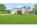 View of a beautiful two-story home featuring a well-maintained yard and a two-car garage at 1194 Grandview Cir, Powder Springs, GA 30127