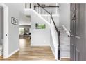 Inviting foyer with hardwood floors, staircase, and neutral paint tones, offering a warm welcome at 1194 Grandview Cir, Powder Springs, GA 30127