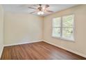 Bright bedroom featuring a ceiling fan, wood-look flooring and natural light from the double window at 1284 Brandl Dr., Marietta, GA 30008