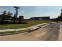 Landscaped entrance to Klondike Reserve featuring lush green lawns and decorative brickwork at 218 Seward St # 92, Conyers, GA 30094