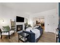 Bright living room with a modern fireplace, stylish decor, and an open layout at 212 Haralson Ne Ave, Atlanta, GA 30307