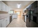 Bright kitchen featuring white cabinets, stainless steel appliances, and ample counter space at 297 Edison Dr, Stockbridge, GA 30281