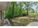 Expansive backyard with lush lawn and mature trees and shrubbery at 3661 Boring Rd, Decatur, GA 30034