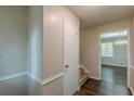 Light-filled hallway with a coat closet and hardwood floors at 3661 Boring Rd, Decatur, GA 30034