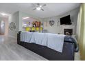 Open concept living room featuring hardwood floors, a fireplace, and plenty of natural light at 2003 Burns View Ln # 2, Lawrenceville, GA 30044