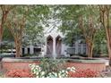 Building entrance with fountain, manicured plants, and grand doorway at 2870 Pharr Court South Nw # 2404, Atlanta, GA 30305