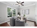 Bright office space with a large window, modern desk and plush seating, perfect for working from home at 333 Gardens Of Harmony Dr, Canton, GA 30115