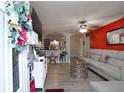 Open-concept living room with a modern sofa and a view of the kitchen at 377 Black Oak Ct, Lawrenceville, GA 30046