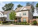 Charming two-story home boasts a brick facade, neutral siding, and a well-manicured front yard with a decorative fence at 2792 Mathews Se St, Smyrna, GA 30080