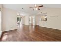 Spacious living area with hardwood floors and access to a patio, offering seamless indoor-outdoor living at 909 Wentworth Ct, Alpharetta, GA 30022