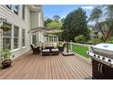 Inviting back deck features an outdoor seating area and grill perfect for relaxing or entertaining at 1029 Ector Nw Dr, Kennesaw, GA 30152