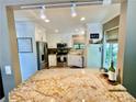 Bright kitchen with stainless steel appliances, white cabinets, and granite countertops at 2694 Tritt Springs Ne Dr, Marietta, GA 30062