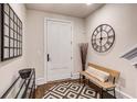 Cozy entryway featuring a geometric rug, bench, decorative mirror, and modern accents at 312 Stonemont Dr, Atlanta, GA 30305