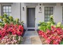 Landscaped front entrance featuring a gray front door with decorative plants and walkway at 312 Stonemont Dr, Atlanta, GA 30305