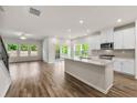 Bright kitchen boasts stainless appliances, granite countertops, and ample natural light at 423 Murphy Ave, Canton, GA 30114