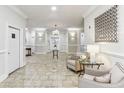 Inviting condo lobby with neutral paint, tiled floors, elegant lighting, and comfortable seating at 11 Perimeter E Ctr # 1402, Dunwoody, GA 30346