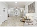 Inviting lobby with tile floors, comfortable seating, decorative art, and elegant lighting fixtures at 11 Perimeter E Ctr # 1402, Dunwoody, GA 30346
