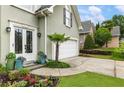 Close up of a charming home's front entrance, featuring a lush garden and a well-maintained lawn at 1450 Crescent Walk, Decatur, GA 30033