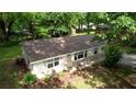 Overhead view of home showing new roof, manicured landscaping, and inviting front entrance at 50 Woodland St, Buford, GA 30518