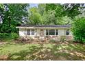 Traditional home with a well-maintained front yard and inviting curb appeal at 50 Woodland St, Buford, GA 30518