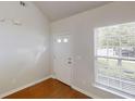 Bright entryway with natural light, featuring hardwood floors and a white front door at 3827 Shenfield Dr, Union City, GA 30291