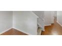 View of the entry hallway featuring hardwood floors, a carpeted stairway, and neutral walls at 3827 Shenfield Dr, Union City, GA 30291