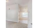 Bright living room with vaulted ceiling, fresh neutral paint, and lots of natural light at 4162 Ward Lake Trl, Ellenwood, GA 30294