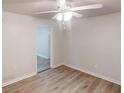 Bright bedroom featuring a ceiling fan, neutral walls, and vinyl plank flooring at 5574 Oak Grove Dr, Acworth, GA 30102