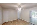 Bright living area with light walls, vinyl plank flooring, and access to the deck at 5574 Oak Grove Dr, Acworth, GA 30102