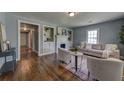 Bright living room showcasing hardwood floors, built-in shelving, and a decorative fireplace at 103 Chicamauga Sw Ave, Atlanta, GA 30314