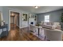 Stylish living room with hardwood floors, fireplace, and built-in bookshelves at 103 Chicamauga Sw Ave, Atlanta, GA 30314