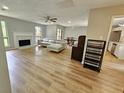 Bright and airy living room featuring a fireplace and seamless flow to the dining area at 1192 Sandalwood Dr, Lawrenceville, GA 30043