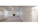 Bright living room features vaulted ceilings, fireplace, and neutral decor at 150 Mills Creek Ln, Covington, GA 30016